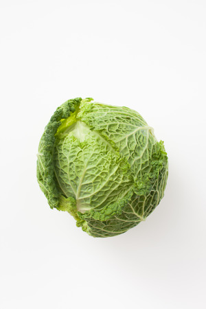 Background image with a fresh cabbage. Ingredient for cooking healthy meals.の写真素材