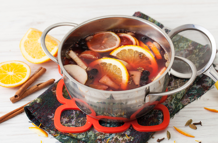 Recipes for mulled wine at home. The use of honey, wine, oranges, cinnamon, cardamom, cloves, cumin, coriander, apples and black pepper.の写真素材