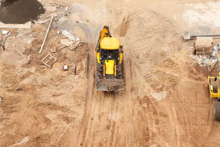 Construction of a multi-storey building and equipment around. Use of technology. Copy space text