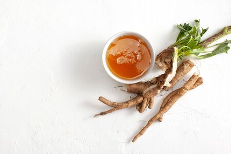 Chicory root (Cichorii intybi radix) and hot honey are used for the relief of symptoms of mild digestive disorders and temporary loss of appetite.の写真素材