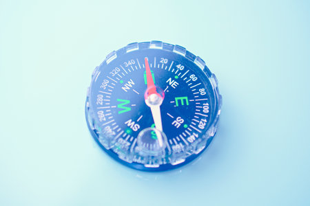 compass on a turquoise background