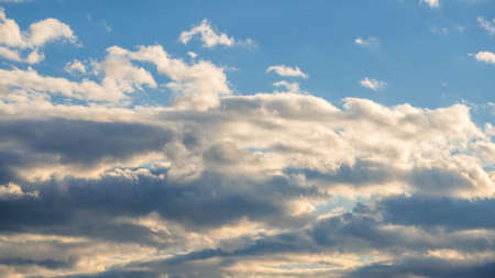clouds against a brilliant blue skyの写真素材