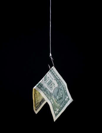 money hanging on a fish hook as bait - concept image - risk, profit, loss, investment, etc.の写真素材