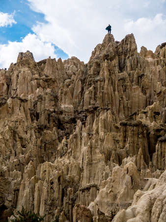 Indigenous Musician standing on a rock in Valle de la Luna, Bolivia - Valley of the Moonの写真素材