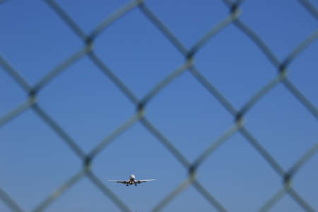 plane between the gate, at the airport, as it arrives at its destinationの写真素材