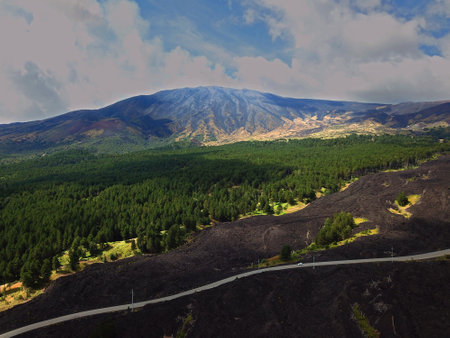 View of Etna volcano craters among the clouds near Piano Provenzana. Sicily, Italyの写真素材
