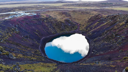 Aerial view of Kerid, is a beautiful crater lake of a turquoise color located on the South-West of Icelandの写真素材