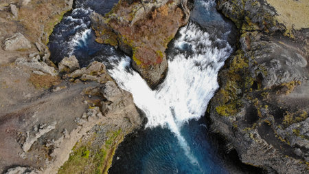 Aerial view of Hjalparfoss waterfall in southwest Iceland