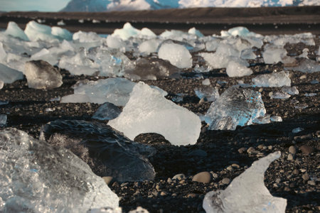 Beautiful chunks of ice, washed up on Jokulsarlon beach, Iceland at sunrise.