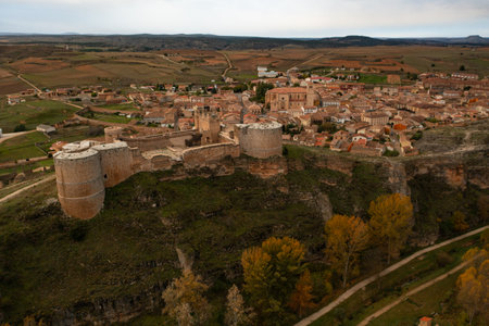 Aerial view of the Berlanga del Duero castle and the rest of the town on a cloudy autumn day