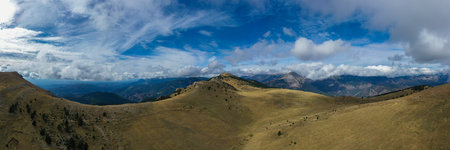 Panoramic aerial view of the Rasos Peguera mountain range with all the dry vegetation, in Catalonia,...