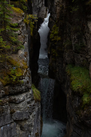 Waterfall between rocks in Maligne Canyon, in Jasper, Canada.の写真素材