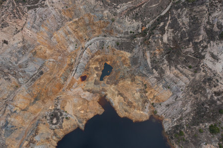 Aerial view of La Union Mining Park landscape and ocher-tinted water lake, called Red Lake