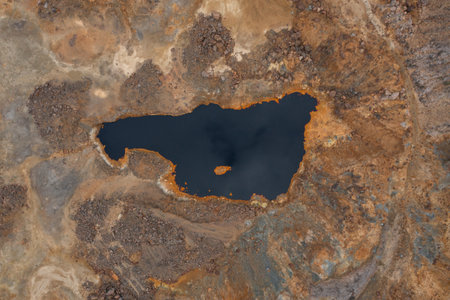 Aerial view of La Union Mining Park landscape and ocher-tinted water lake, called Red Lake, in...