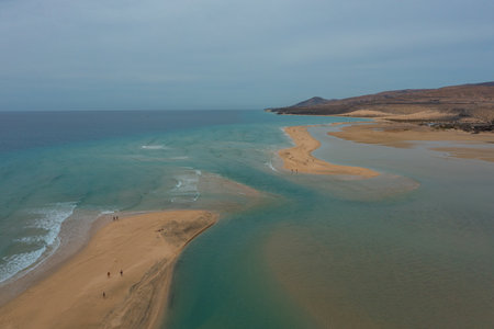Drone shot of Sotavento Beach in Fuerteventura, showing tidal sandbanks and turquoise waters in a stunning natural coastal landscape.の写真素材
