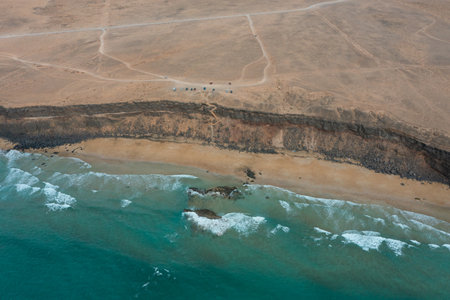 Stunning aerial photograph of Playa de las Escaleras, a hidden gem on the west coast of...