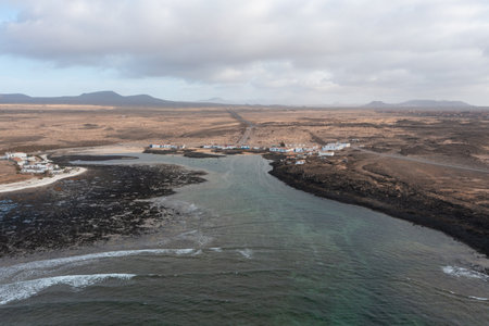 Stunning aerial photograph of Majanicho, a small coastal village in northern Fuerteventura, Canary...