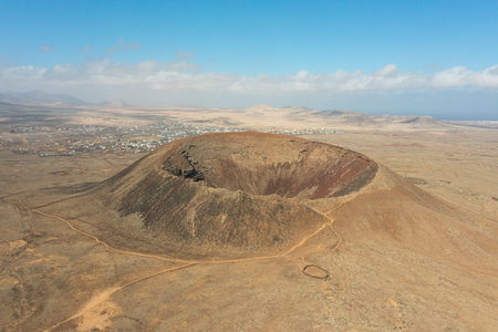 Stunning aerial photograph of Calderon Hondo volcano taken on a clear, sunny day. The image...