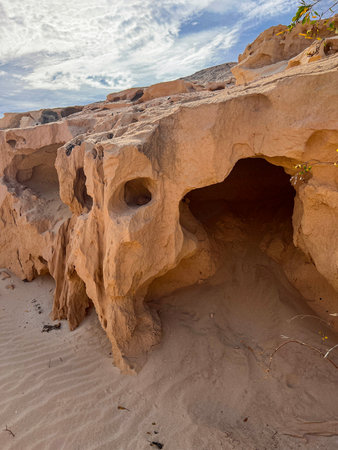 Golden sandstone cliffs and sculpted formations in Barranco Encantado, a unique geological site in...
