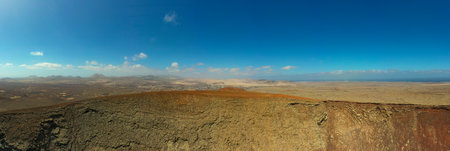 Panoramic landscape of CalderÃ³n Hondo volcano, near the village of Lajares in northern Fuerteventura. The image reveals the ancient crater and the stunning views of the island's volcanic origins and rugged wilderness.の写真素材