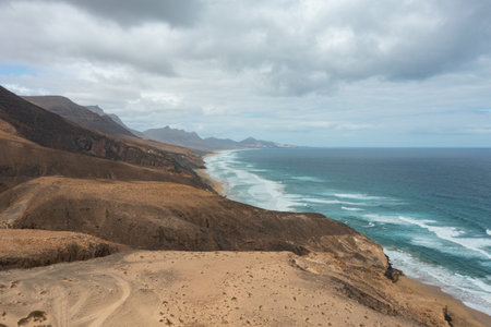 Stunning view of the remote Jandía desert beaches in Fuerteventura, Canary Islands. Golden sand...