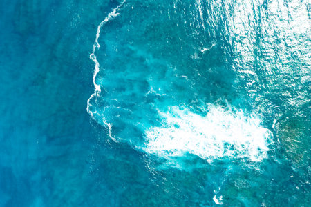 Powerful ocean waves captured in motion, showing the natural energy and movement of the sea. Ideal...