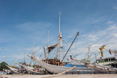 Wooden ships anchored at Paotere Harbor in Makassar, Indonesia.のeditorial素材