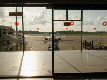BATAM, INDONESIA - DECEMBER 13, 2014: Planes parked at Hang Nadim International Airport in Batam, Indonesia.のeditorial素材