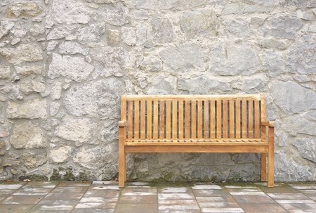 bench waiting stone wallの写真素材