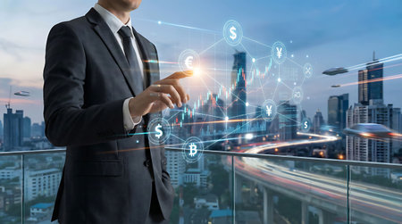 Double exposure of business man using mobile phone and financial graph on the cityscape backgroundの素材