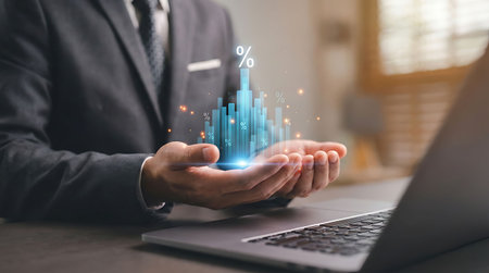 Businessman working with financial data on laptop computer in office. Finance and accounting concept.の素材