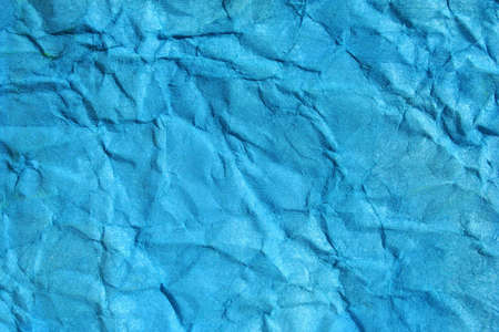 Turkish blue color wrinkled paper as background. Art is painted by photographer.の写真素材