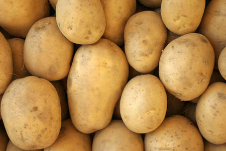 Potatoes at bazaar as backgroundの写真素材