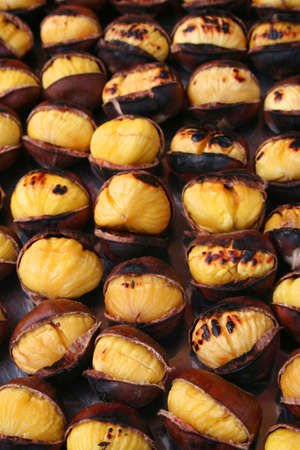 Delicious roasted chestnuts as backgroundの写真素材