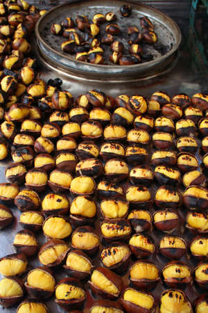 Delicious roasted chestnuts as backgroundの写真素材