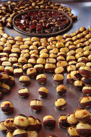 Delicious roasted chestnuts as backgroundの写真素材
