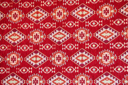 Red color turkish patterned mat as backgroundの写真素材