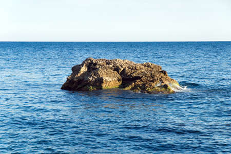 Small rocky island in the sea against  sky  Crimea  Ukraineの写真素材