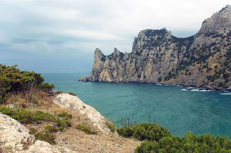 Sea coast with mountains against the background cloudy sky  Nature reserve Novy Svet  Crimea  Ukraineの写真素材