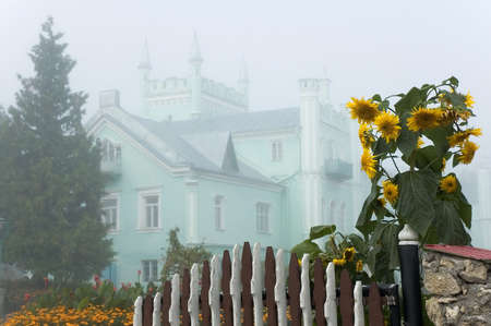Ancient palace in the fog with sunflowers  Belokrinitsa  Ternopil region  Ukraineのeditorial素材