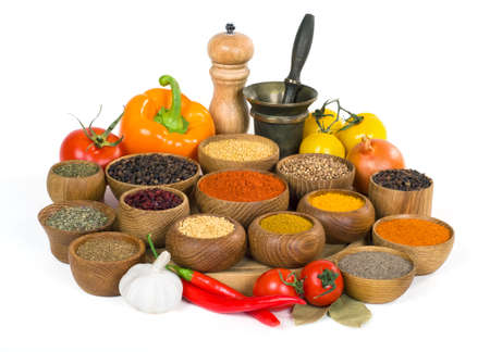 various spices and herbs in wooden bowl on white backgroundの写真素材
