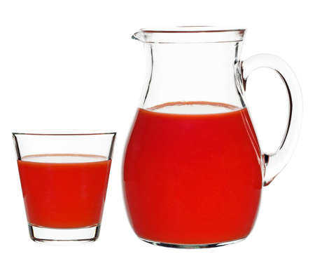 tomato juice in a glass and a carafe on a white backgroundの写真素材