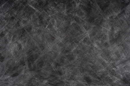 Black background with white chalk stains.  Abstract backdrop.の写真素材