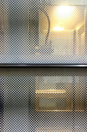 Window with dot pattern in subway stationの写真素材