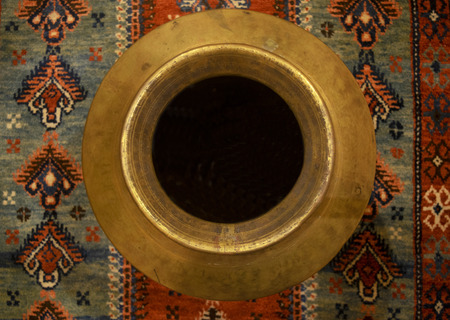 Urn from above on rugの写真素材