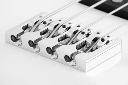 White electric bass strings bridge detailの写真素材