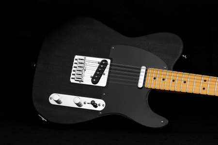 Black telecaster electric guitar body on black backgroundの写真素材