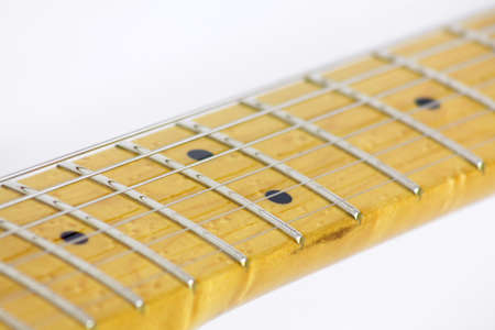 Handle and strings of electric guitar on white backgroundの写真素材