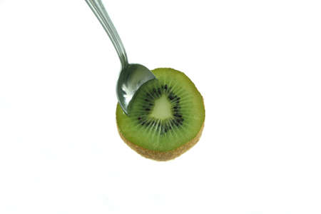 kiwi with spoonの写真素材