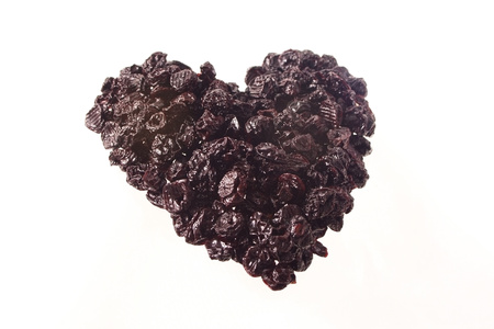 Heart made of dried cherryの写真素材
